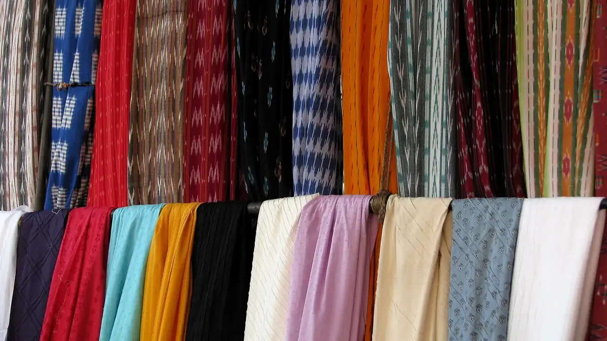 Rolls of colourful woven fabric for sale in a Chennai market