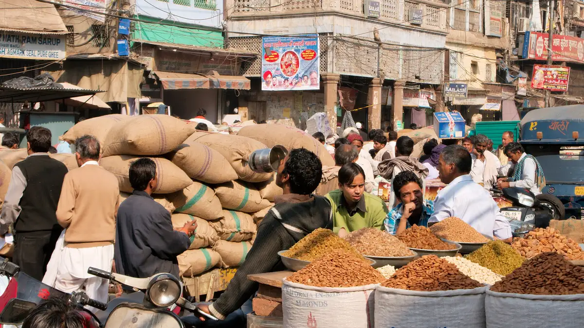 Traders and sacks of dry fruits and spices at Khari Baoli market, Delhi