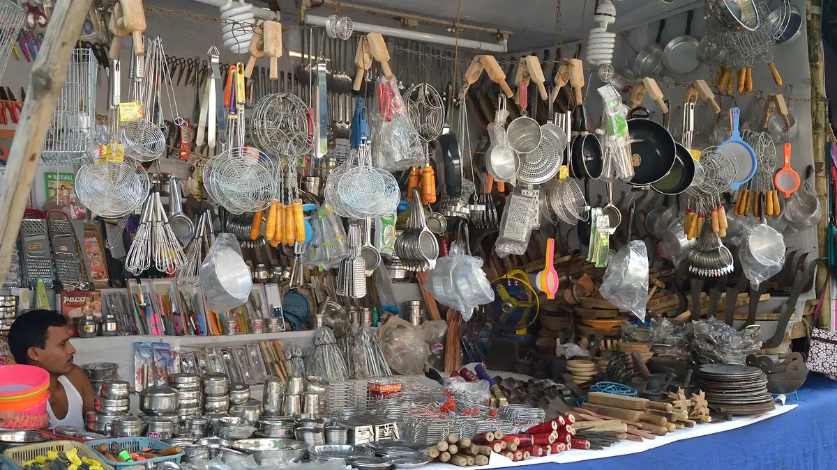 A household utensil stall in Kolkata hung with steel and brass vessels